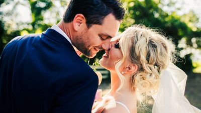 wedding bride and broom almost kissing
