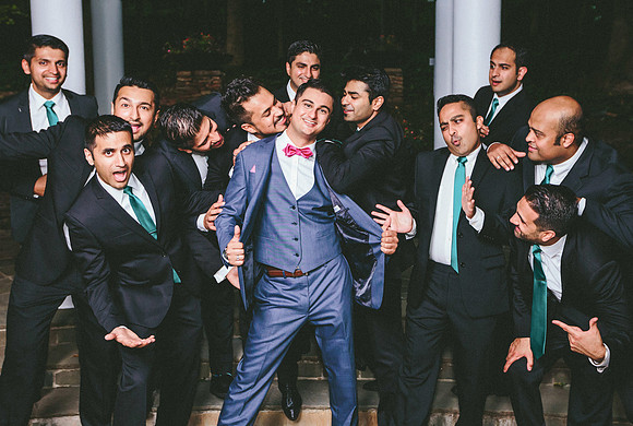 groomsmen silly pose wedding