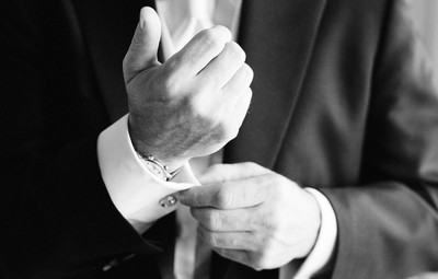 groom cufflink pose wedding