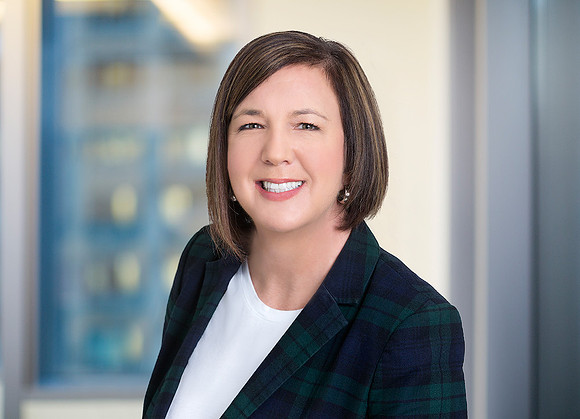 woman corporate business headshot on location with building in background