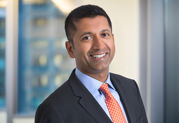 man corporate business headshot on location with building in background