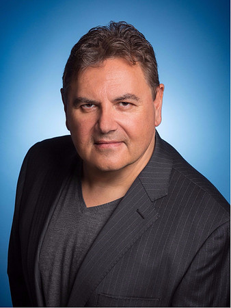 Man Headshot Executive with blue background in Studio