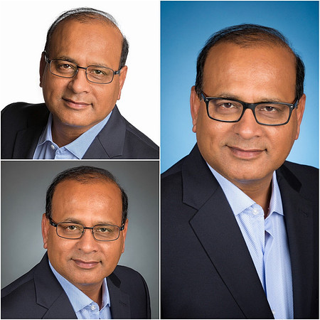 man_headshot_studio_with_white_blue_and_gray_backdrop