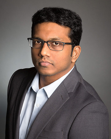 man_wearing_gray_jacket_portrait_headshot_studio