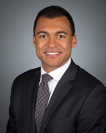 man_headshot_portrait_corporate_executive_with_gray_background