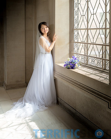 wedding_bride_posing_by_window_san_francisco_city_hall