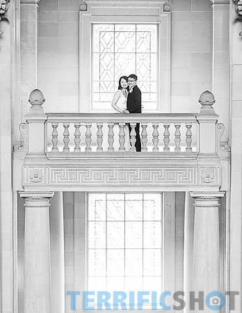 wedding_couple_balcony_san_francisco_city_hall+windows-bw