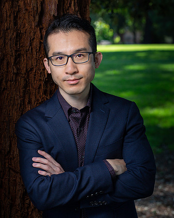 man_headshot_leaning_against_tree