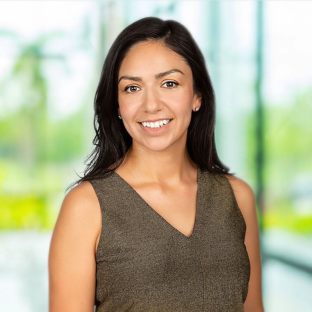 woman_corporate_headshot_blurred_office_background