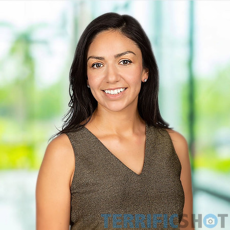 woman_corporate_headshot_blurred_office_background-min