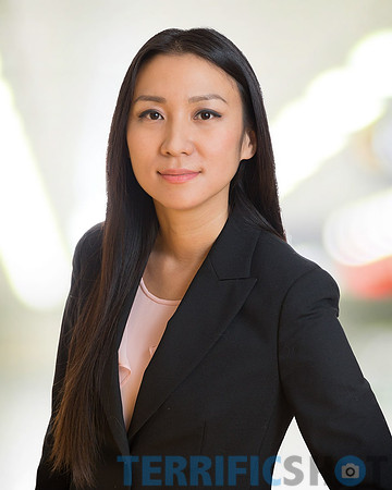 woman_headshot_with_white_office_blurred_background-min