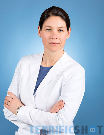 woman_in_medical_lab_coat_white_portrait-min